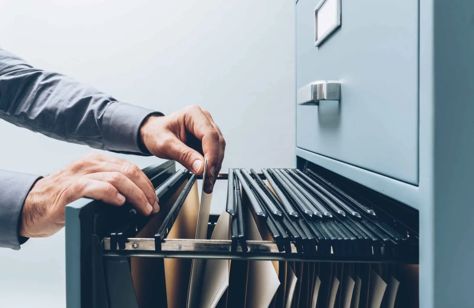 Office clerk searching for files